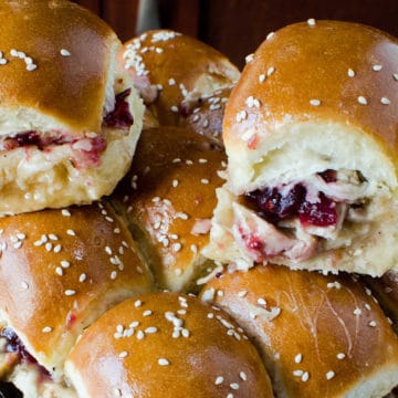 cranberry turkey sliders stacked on a serving platter