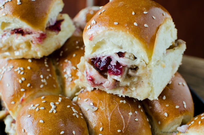 Cranberry and Leftover Turkey Sliders stacked on a serving platter