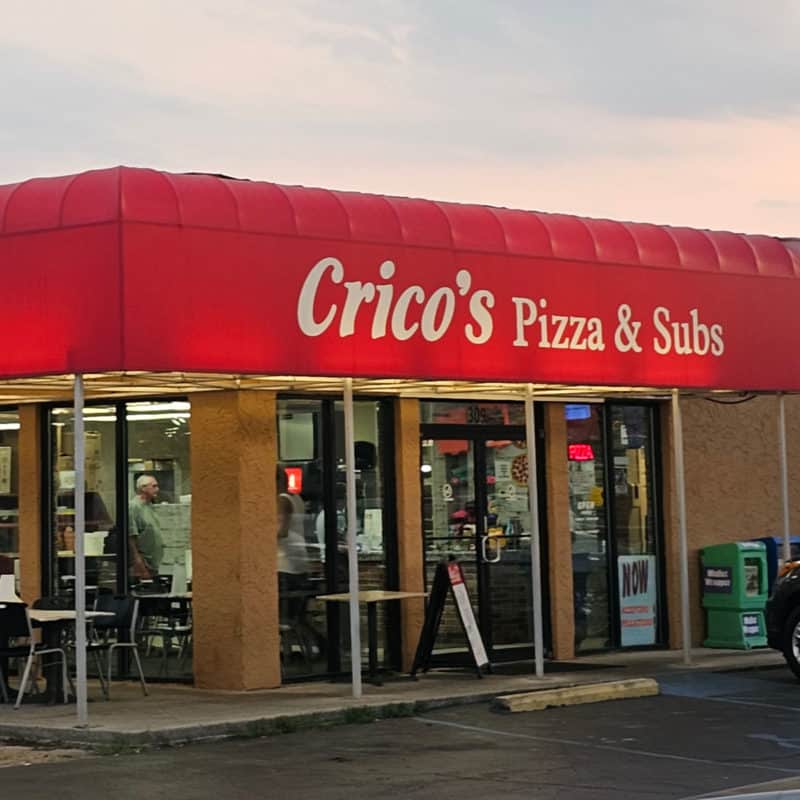 Crico's Pizza & Subs entrance with red awning