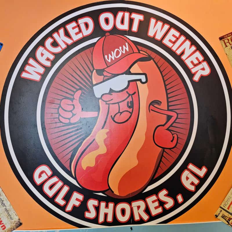 Wacked out Weiner Gulf Shores sign with a hot dog wearing a red hat