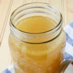 Homemade chicken stock in a mason jar glass