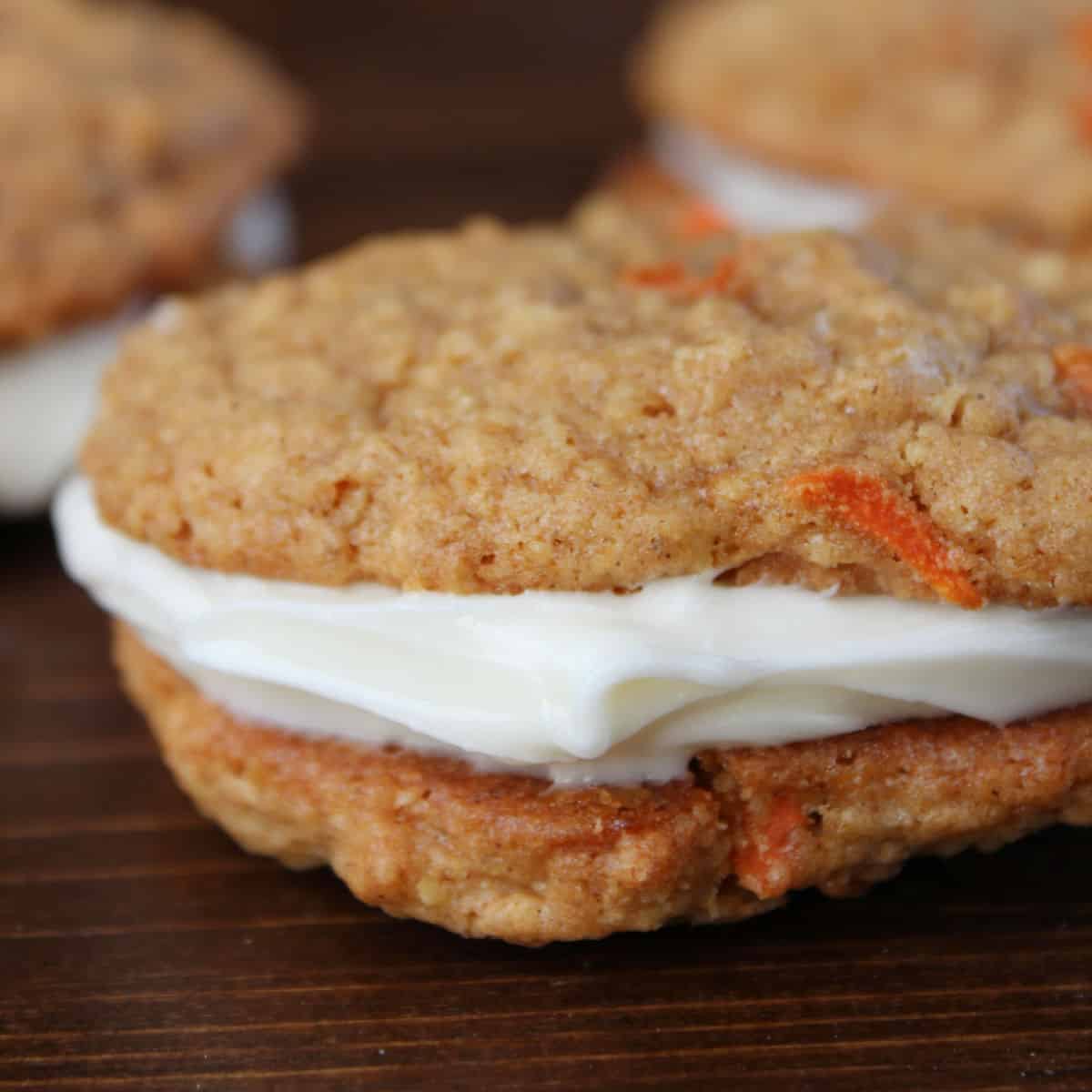 Carrot Cake Oatmeal whoopie pie cookie on a wood platter