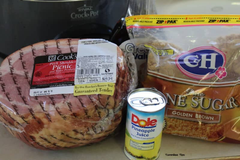 spiral ham, pineapple juice, and brown sugar next to a slow cooker