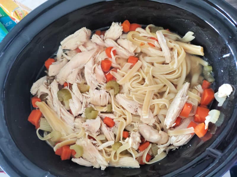 Crockpot Chicken Noodle Soup in a black slow cooker