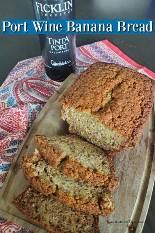 Port Wine Banana Bread over a loaf of bread on a wooden cutting board and Ficklin Vineyards Tinta Port bottle