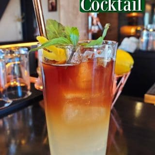 Ranch Tea Cocktail text over a taall glass with mint sprig and metal straw