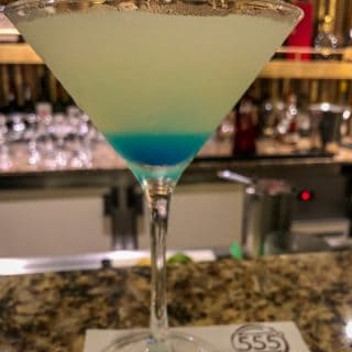 Seven Seas Martini over a layered cocktail in a martini glass