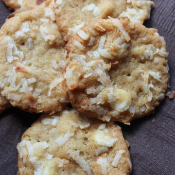 White Chocolate Coconut Macadamia Nut Cookies on a brown paper napkin