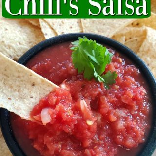 Copycat Chili's Salsa text over a black bowl with salsa and tortilla chips