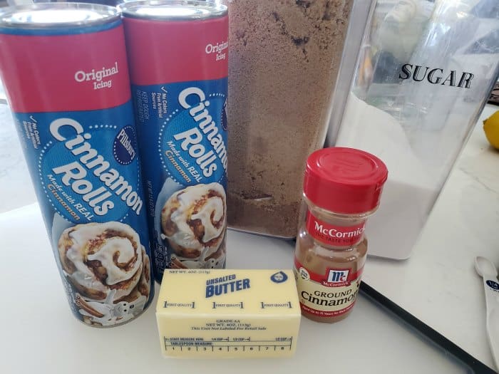 Crockpot Cinnamon Roll Monkey Bread ingredients on a cutting board