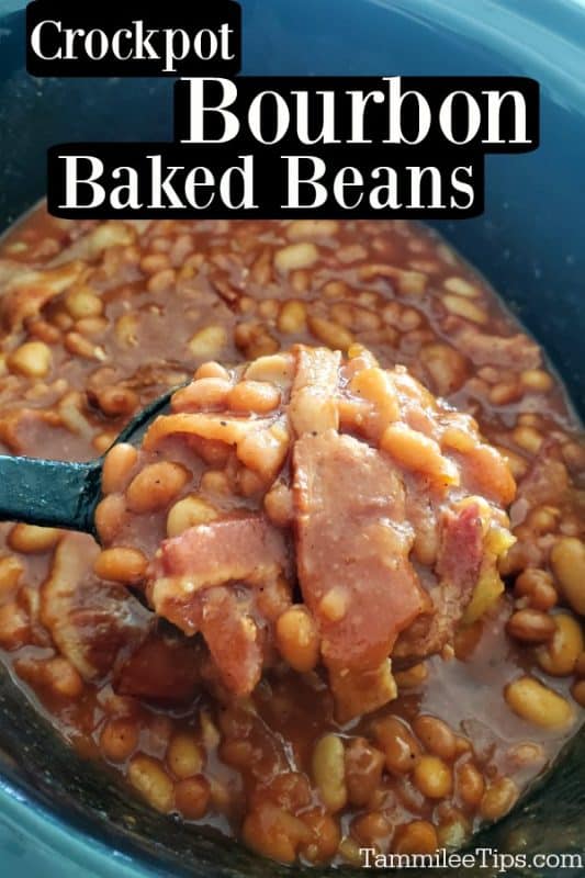 Crockpot bourbon baked beans over a large spoon scooping beans and bacon from the slow cooker 