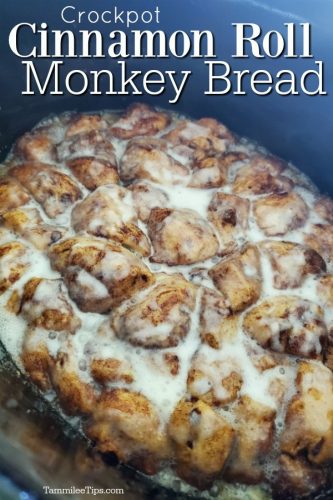 Crockpot Cinnamon Roll Monkey Bread over a slow cooker with cinnamon rolls and icing