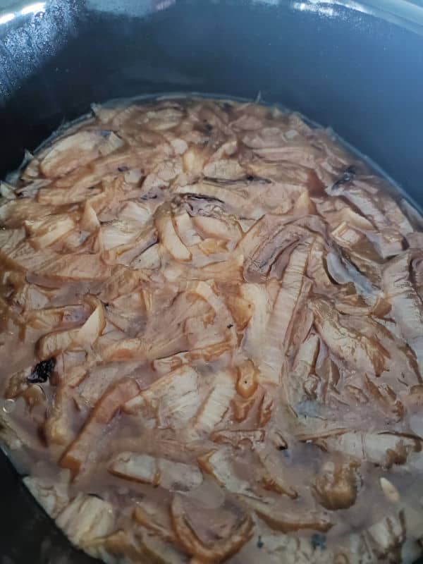crockpot french onion soup in the slow cooker with tons of onions 