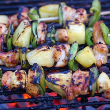Sweet and Spicy Chicken Skewers on the barbecue with pineapple and peppers