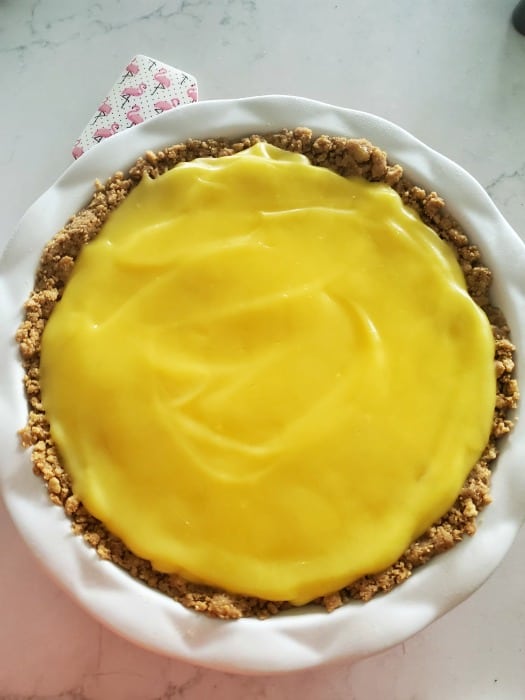 Banana pudding spread in a Nutter Butter crust in a white pie plate