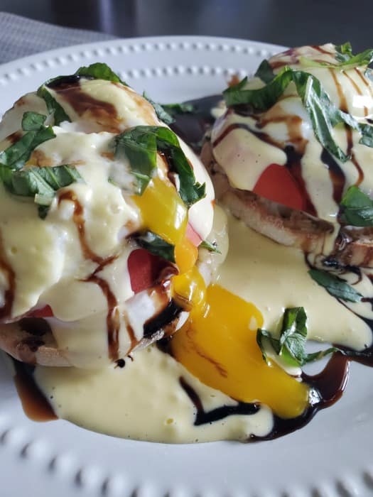 Caprese Eggs Benedict with runny egg yolk