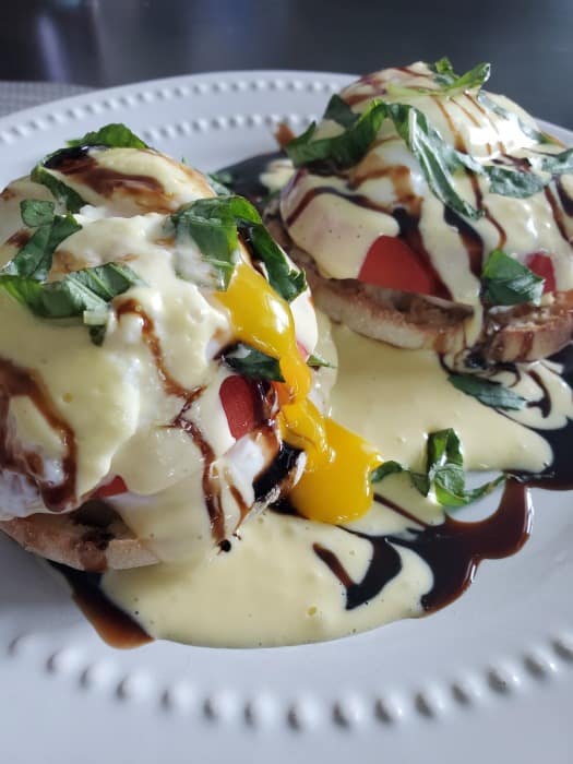 Caprese Eggs Benedict on a white plate