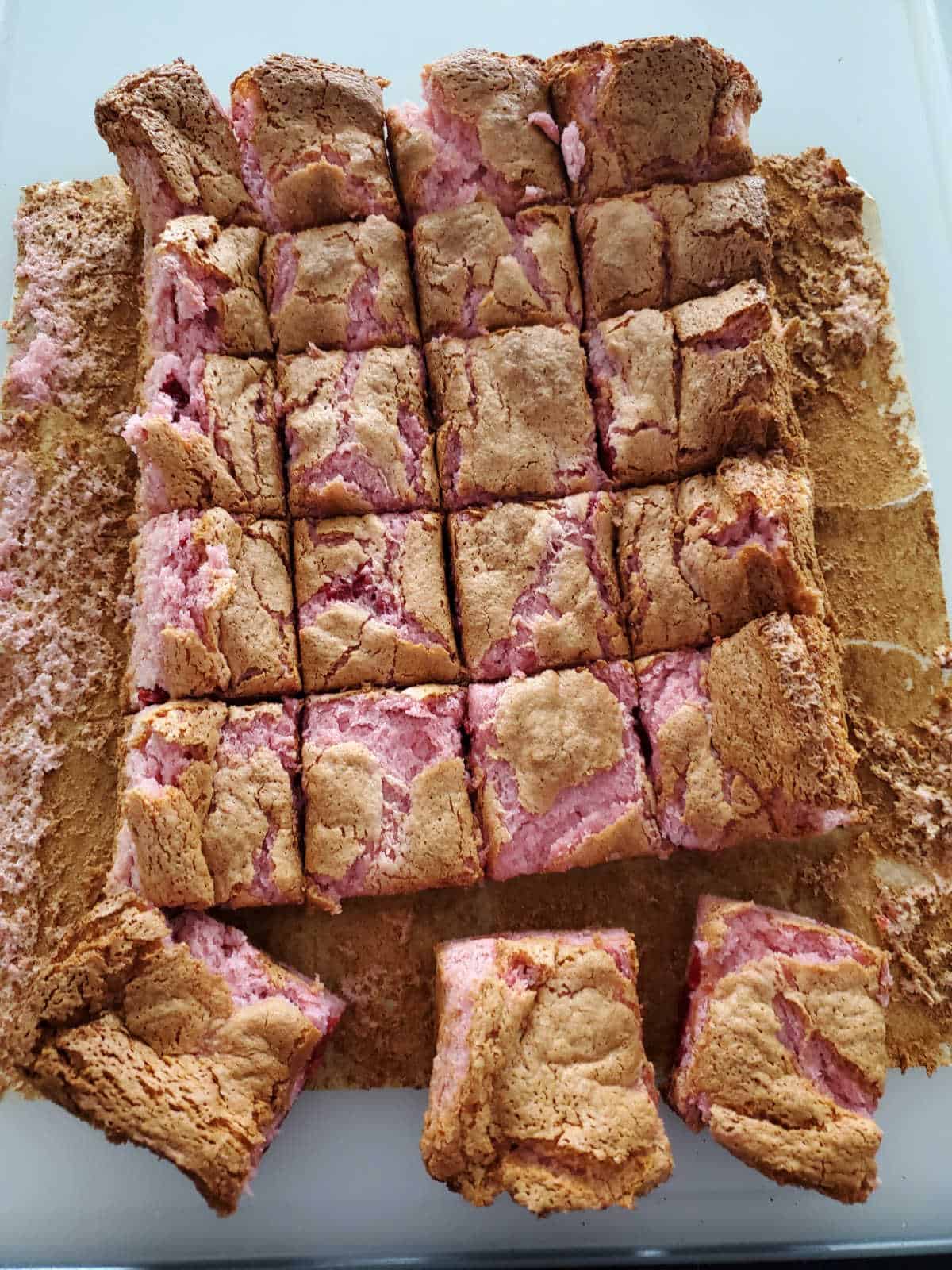 2 ingredient cherry bars cut into square on a parchment paper