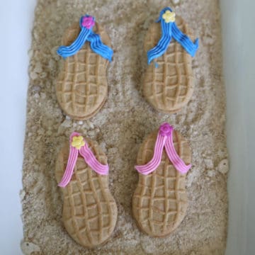 Flip Flop Nutter Butters on edible sand on a white platter