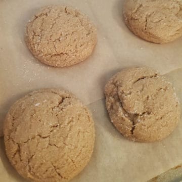 Soft Old Fashioned Molasses Cookies on parchment paper