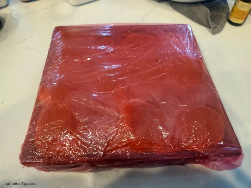 red plastic wrap around a metal baking dish