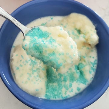 Snow ice cream with blue sprinkles in a blue bowl