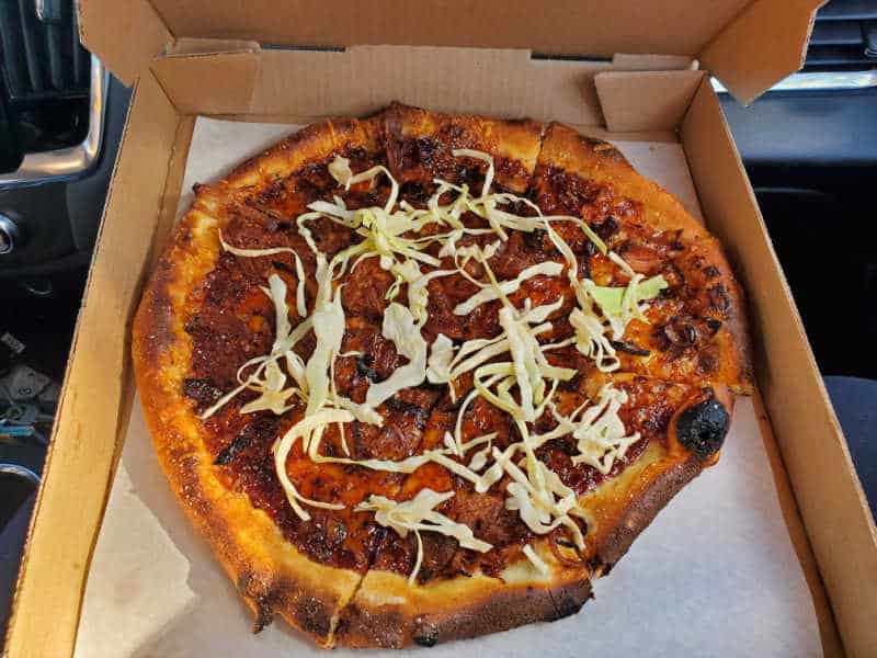 Pizza in a cardboard delivery box