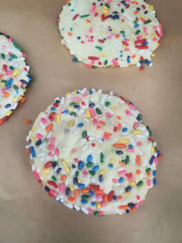 Cookie with sprinkles on parchment paper