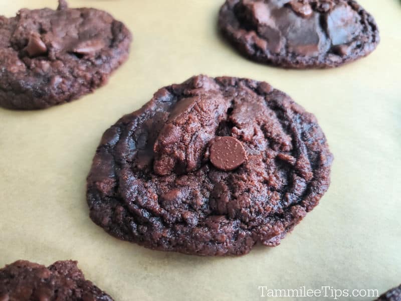 Chocolate brownie cookies lined on parchment paper