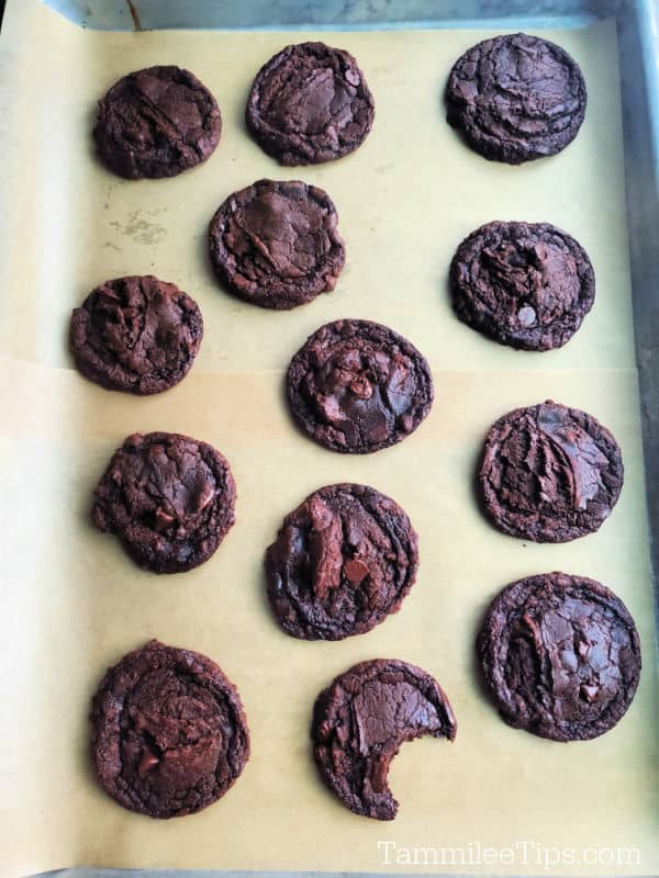 baked brownie cookies on a parchment lined baking sheet