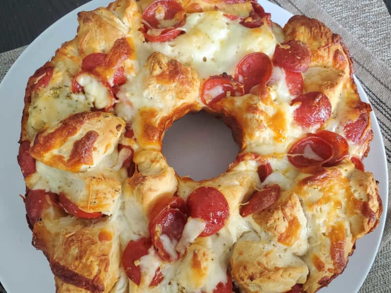 Pepperoni Pizza Monkey Bread on a white circle plate