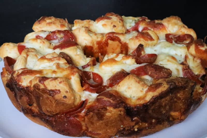 Pepperoni Pizza Monkey Bread on a white circle plate