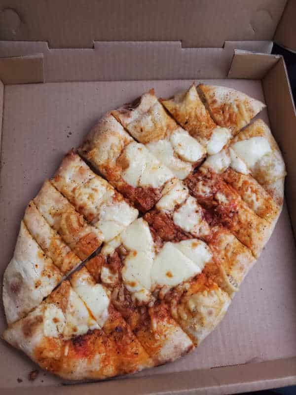 Cheese bread in a cardboard delivery box