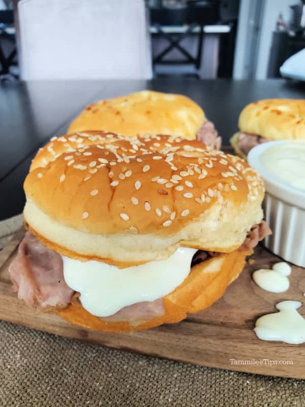 Horsey sauce on a roast beef sandwich on a cutting board. 