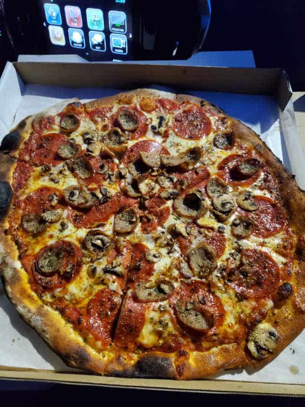 pepperoni, and sausage pizza in a cardboard delivery box