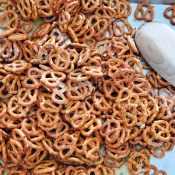 ranch pretzels spread out with a wooden spoon