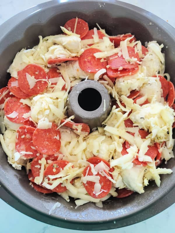 Pepperoni Pizza Monkey Bread unbaked in a Bundt pan