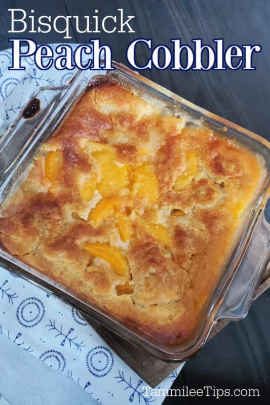 Bisquick peach cobbler text over a glass baking dish with cobbler next to cloth napkin