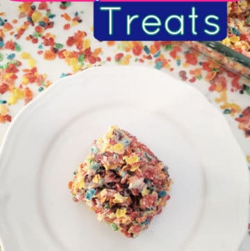 Fruity Pebbles Treats text over a white plate with a fruity pebbles rice crispy treat surrounded by fruity pebbles cereal