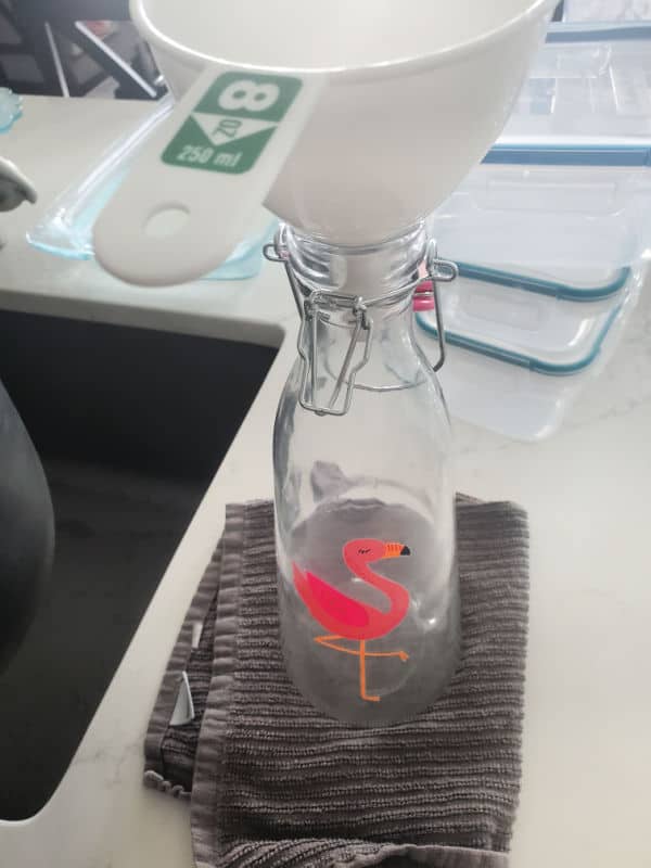 Funnel in the top of a flamingo pitcher. 