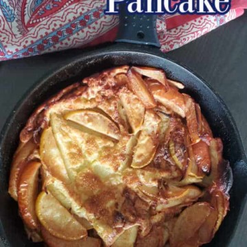 German Apple Pancake text over a cast iron with apple pancake and a cloth napkin