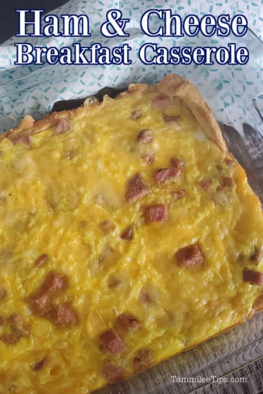 Ham & Cheese Breakfast casserole text over a glass baking dish with egg, ham and cheese casserole