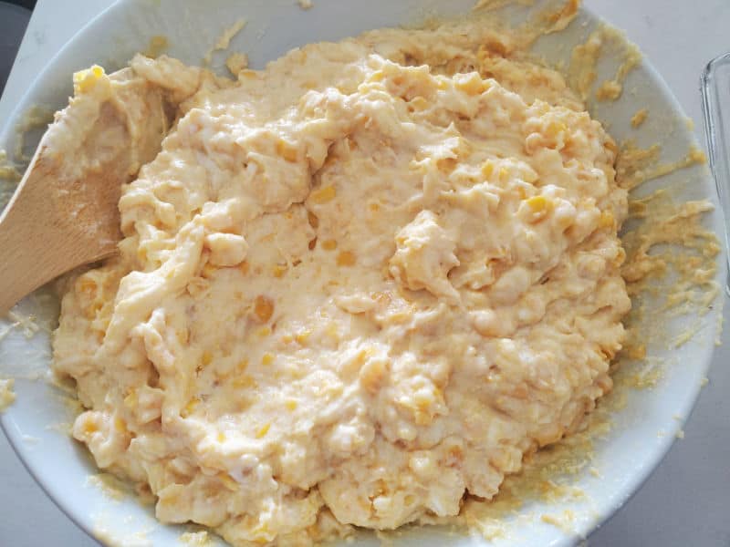 Creamed Corn Casserole Ingredients mixed together in a white bowl
