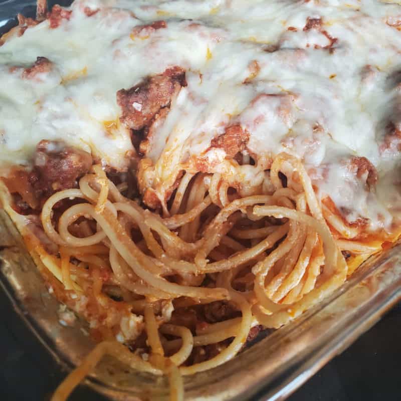 million dollar spaghetti casserole in a glass baking dish