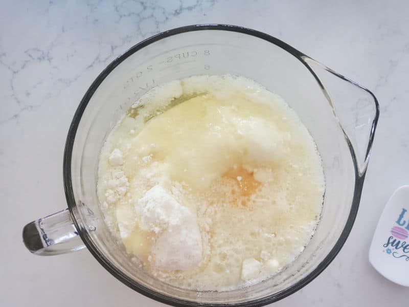 cake mix in a glass batter bowl next to a spatula