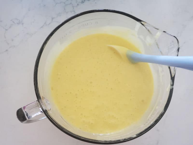 cake mix in a glass bowl with a spatula