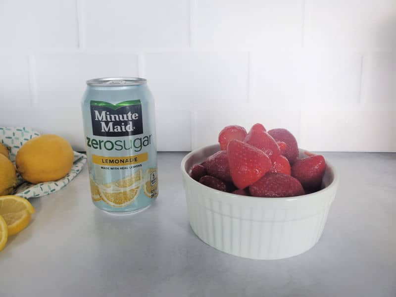 Minute Maid zero sugar lemonade can next to a bowl of strawberries