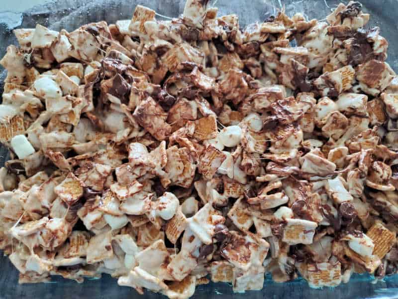 Golden graham smores bars in a baking dish before cutting