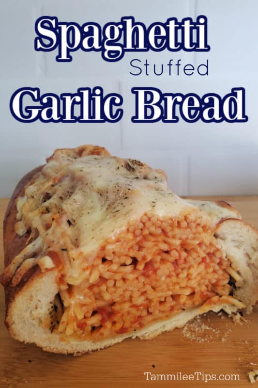 Spaghetti Stuffed Garlic Bread over a loaf of bread stuffed with spaghetti topped with melted cheese 