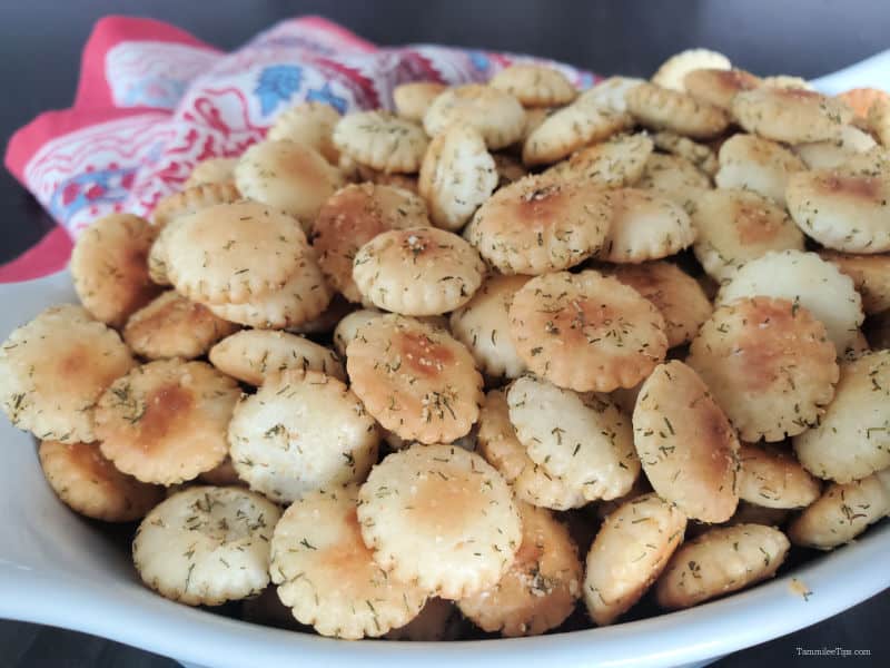  a white bowl filled with dill oyster crackers